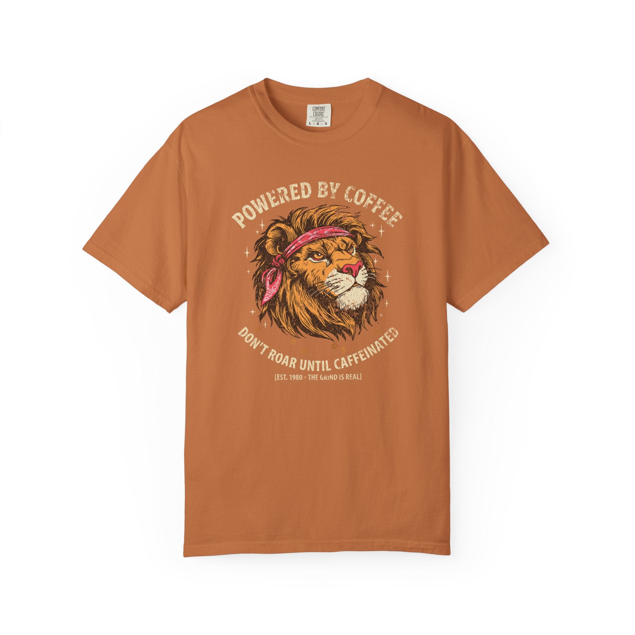 Rust-colored t-shirt with a distressed graphic of a lion wearing a bandana and coffee text.