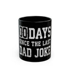 Black coffee mug with white text that reads 00 DAYS SINCE THE LAST DAD JOKE.