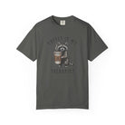 Dark grey unisex cotton t-shirt featuring a raccoon holding a coffee cup with a skull design.