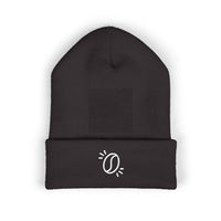 A black cuffed knit beanie featuring a minimalist white embroidered coffee bean graphic.