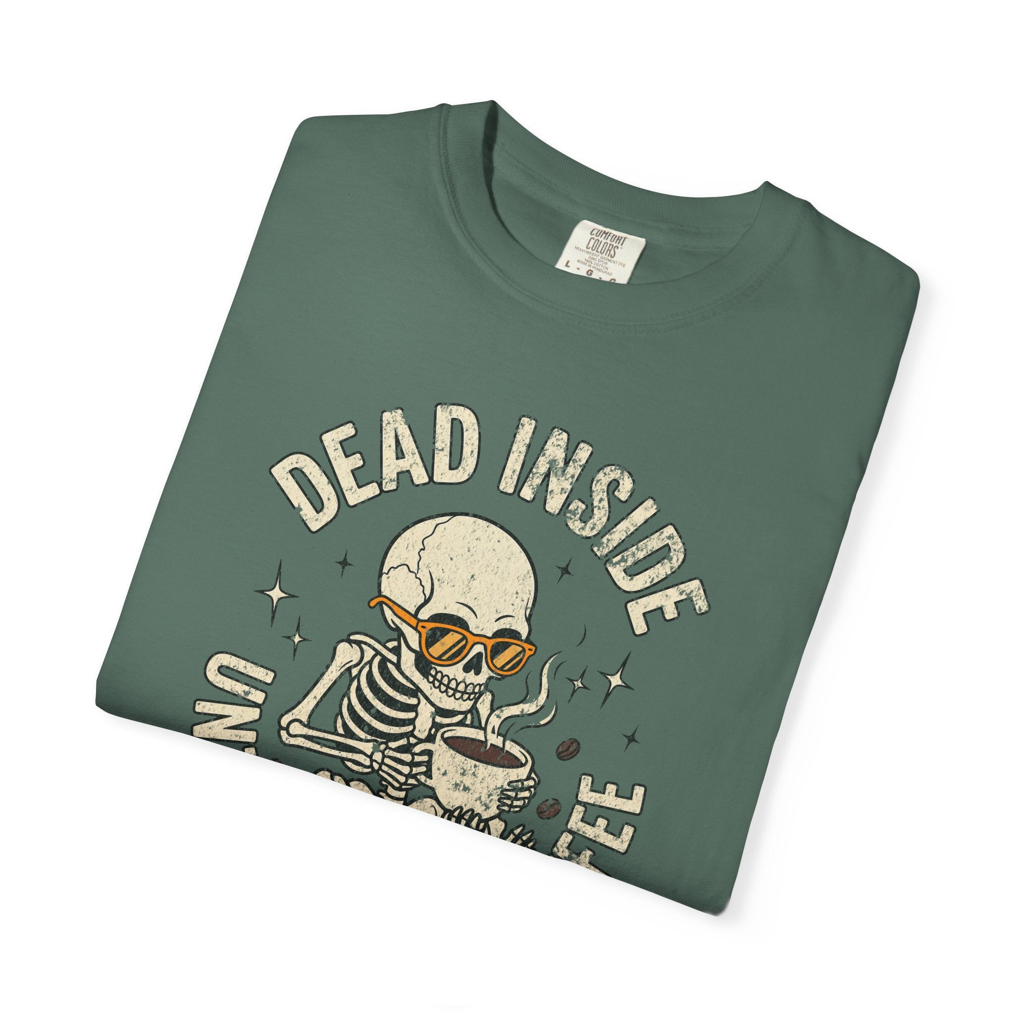 Green t-shirt featuring a skeleton wearing orange sunglasses and holding a cup of coffee.