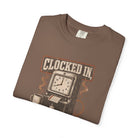 Brown Comfort Colors t-shirt featuring a vintage time clock graphic with the text Clocked In.