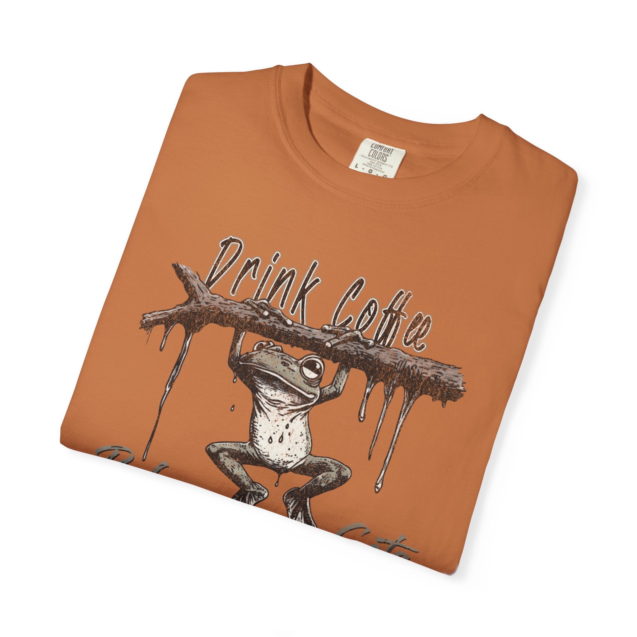 Orange unisex cotton t-shirt featuring a graphic of a frog hanging from a branch with text.