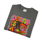 Folded charcoal grey t-shirt with a retro, psychedelic graphic reading "DECAF IS A".