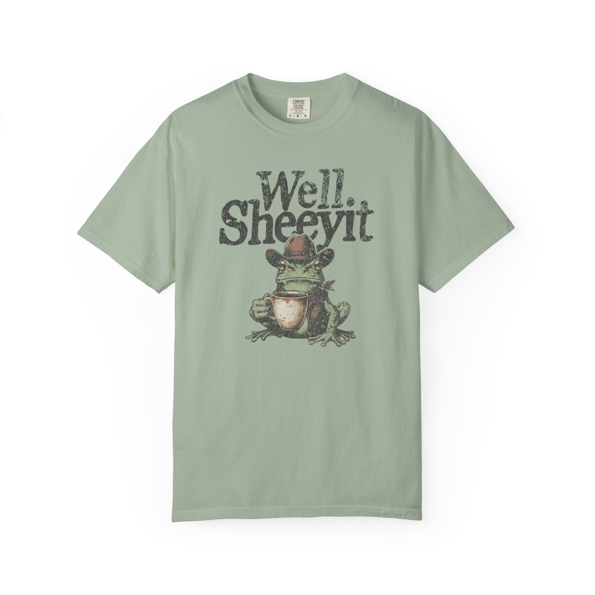 Light green unisex cotton t-shirt featuring a distressed graphic of a cowboy frog holding a mug.