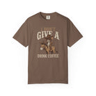 Brown unisex t-shirt featuring a distressed graphic of a cowboy rat riding a donkey with coffee.