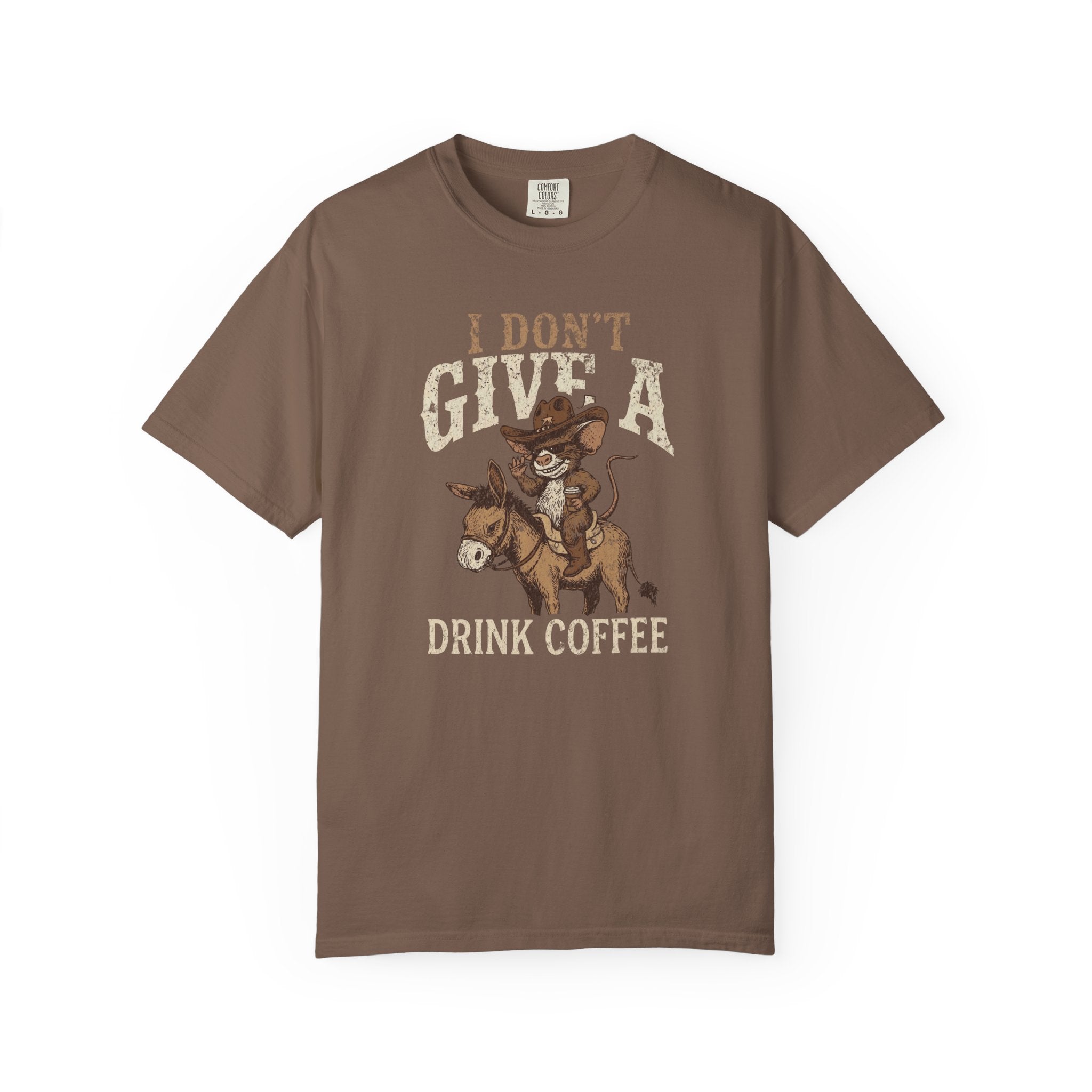 Brown unisex t-shirt featuring a distressed graphic of a cowboy rat riding a donkey with coffee.