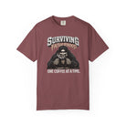 A maroon Comfort Colors unisex t-shirt featuring a skeleton graphic drinking coffee.