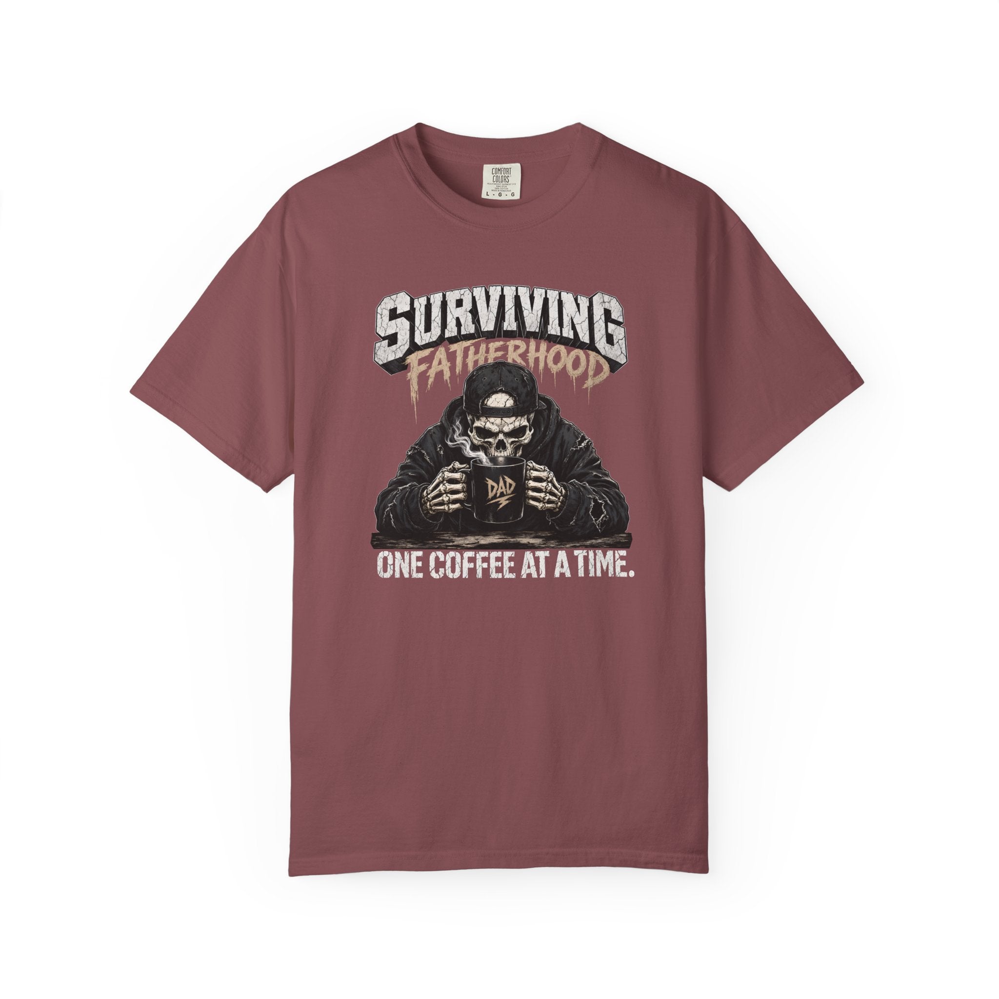 A maroon Comfort Colors unisex t-shirt featuring a skeleton graphic drinking coffee.
