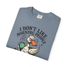 Blue t-shirt featuring a grumpy duck holding a coffee mug with the text I Don't Like Morning People.