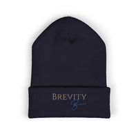 A navy blue cuffed beanie with "BREVITY Brew" embroidered on the front.