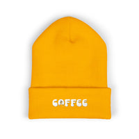 Yellow cuffed beanie with embroidered "COFFEE" text.