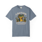 Blue t-shirt featuring a graphic of a frog making peace signs with the text Caution No Filter.