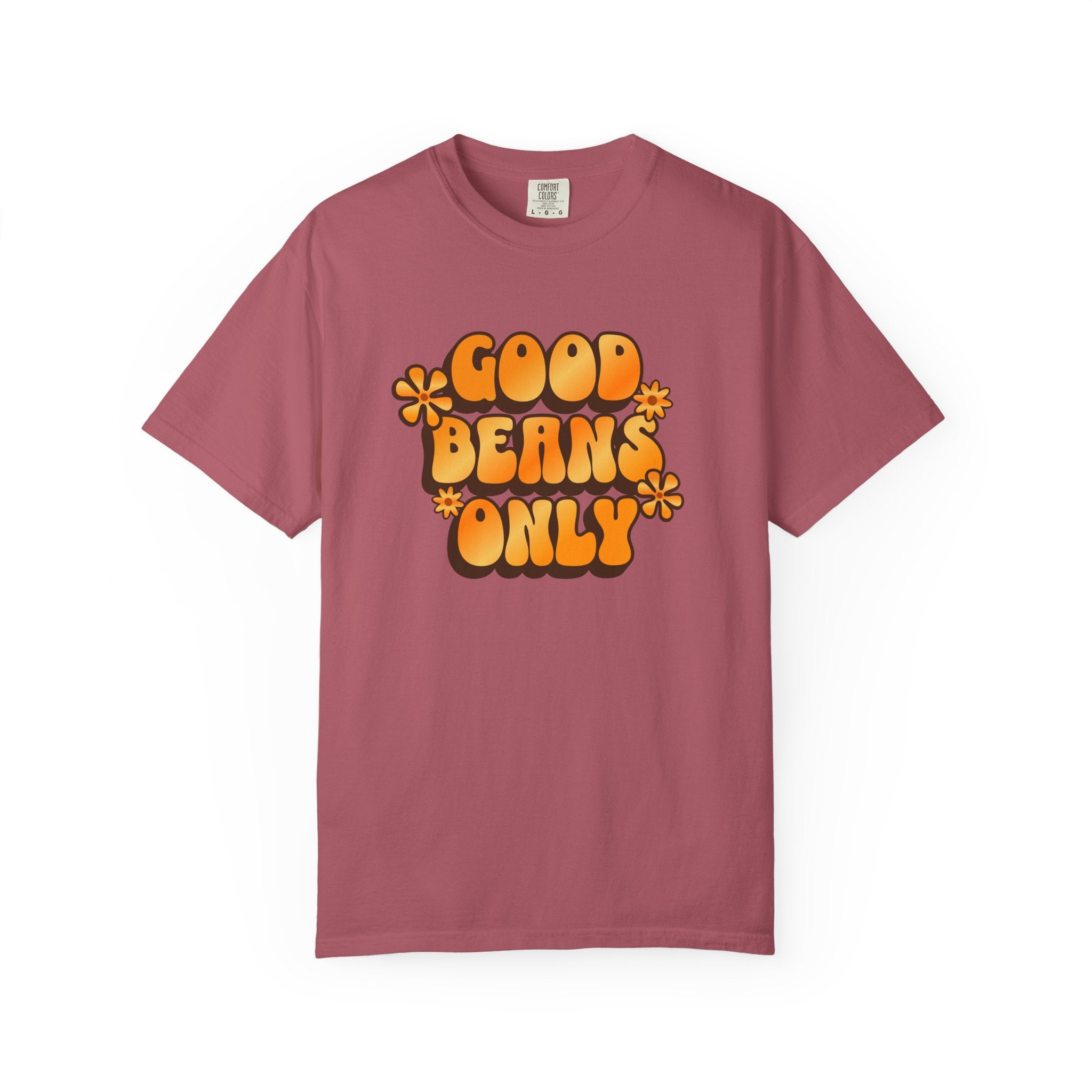 A dusty rose short-sleeved t-shirt featuring retro orange text reading Good Beans Only with flowers.