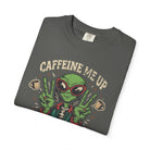 Folded charcoal grey unisex cotton t-shirt with a distressed alien graphic and coffee theme.
