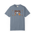 Blue t-shirt with a stick figure holding a coffee mug and petting a dog, with text about magic.