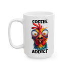 A white ceramic mug featuring a colorful, wide-eyed, frazzled chicken and the text Coffee Addict.