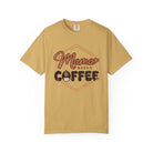 Front view of Mustard Comfort Colors T-shirt with distressed Mama Needs Coffee artwork.