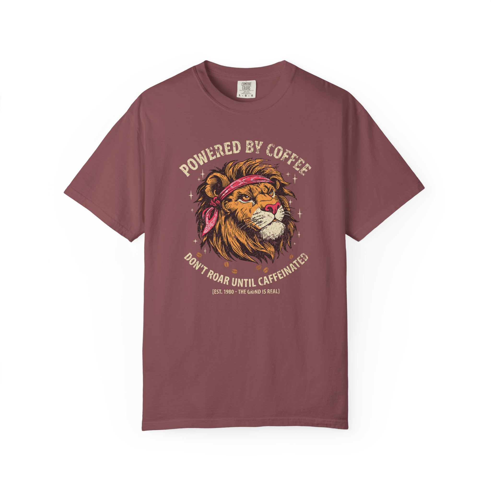 Maroon t-shirt featuring a graphic of a lion wearing a bandana with the text Powered by Coffee.