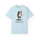 A light blue t-shirt featuring a graphic of a frog holding a coffee mug with the text I have to say weird stuff.