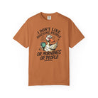 Orange t-shirt featuring a grumpy duck holding a coffee mug with the text I Don't Like Morning People