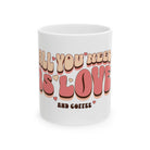 A white ceramic mug featuring retro bubble lettering that reads All You Need Is Love And Coffee.