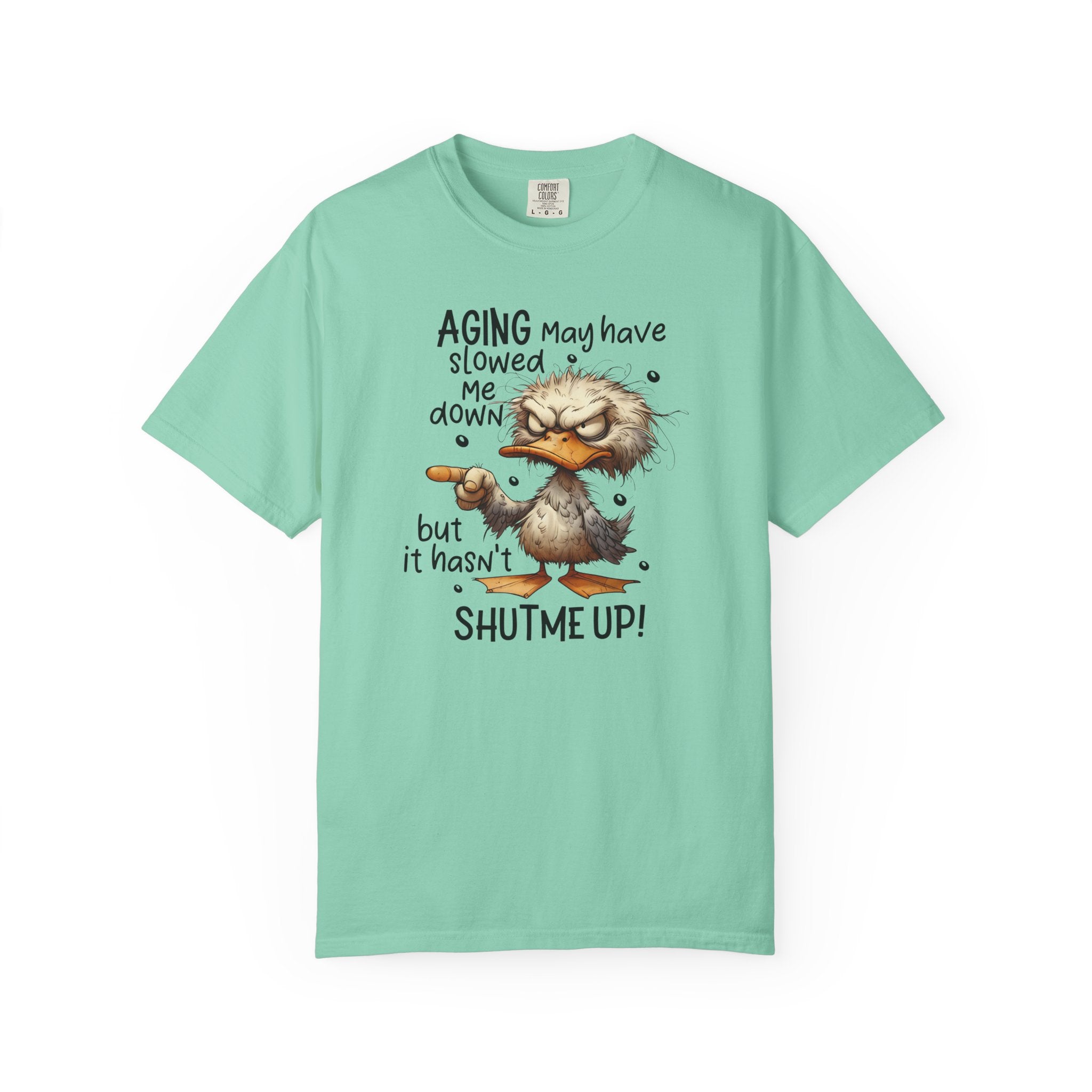 A light green heavyweight cotton t-shirt featuring a grumpy duck graphic and humorous text.