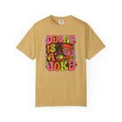 Tan t-shirt featuring a retro, psychedelic graphic that says Decaf Is A Joke.