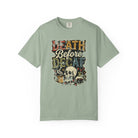 Sage green unisex t-shirt with a distressed graphic of a skull, coffee mug, and coffee pot.
