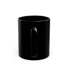 A plain black ceramic mug viewed from the side, showing the handle against a white background.