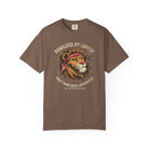 Brown t-shirt featuring a graphic of a lion wearing a bandana with the text Powered by Coffee.