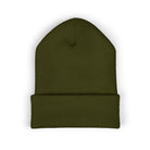 A dark green cuffed beanie made of acrylic fabric.