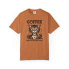 A burnt orange unisex t-shirt featuring a cute, fluffy kitten holding a coffee mug.