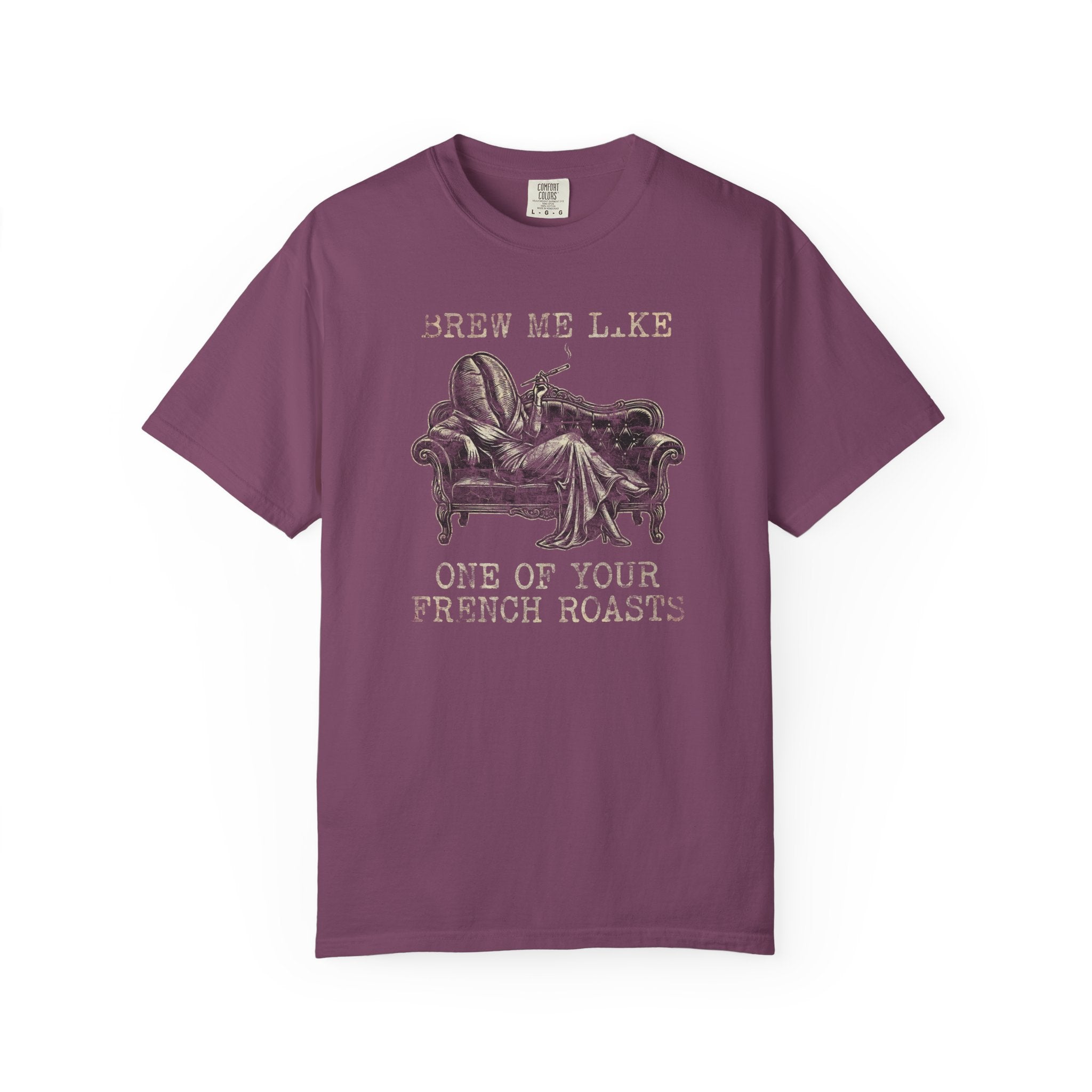 Purple Comfort Colors 1717 t-shirt with a coffee bean character lounging on a sofa graphic.
