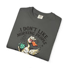 Dark grey t-shirt featuring a graphic of an angry duck holding a coffee mug.