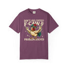 A purple crewneck t-shirt featuring a graphic of a cool rooster wearing sunglasses and a cap.