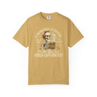 Mustard yellow t-shirt featuring a skeleton graphic with a coffee mug and humorous text.