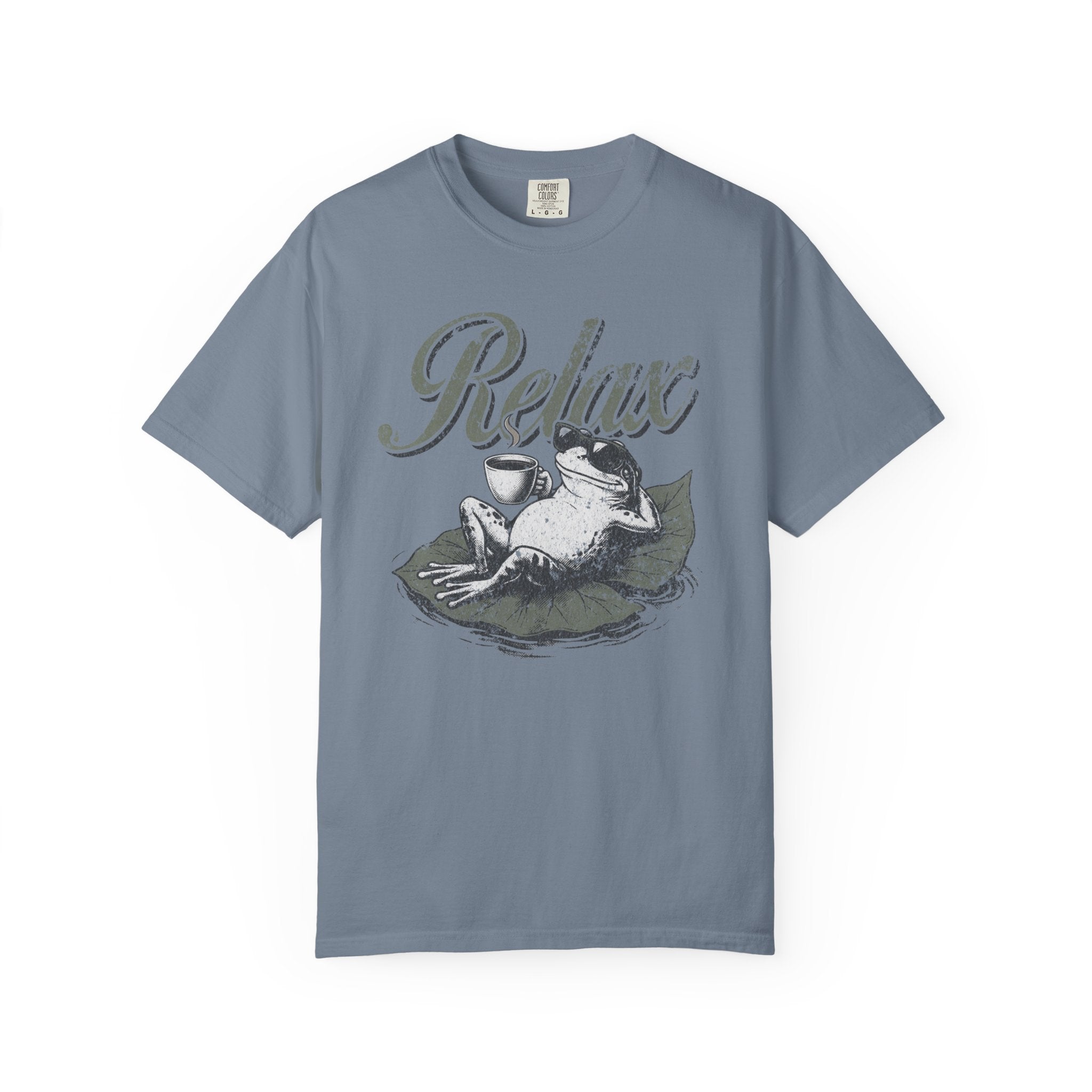Blue unisex t-shirt featuring a graphic of a frog wearing sunglasses and relaxing on a lily pad.
