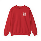 A red crewneck sweatshirt featuring the white text Drip With Sarcasm on the left chest.