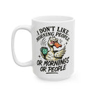 White ceramic coffee mug featuring a grumpy duck illustration and the text I Don't Like Morning People