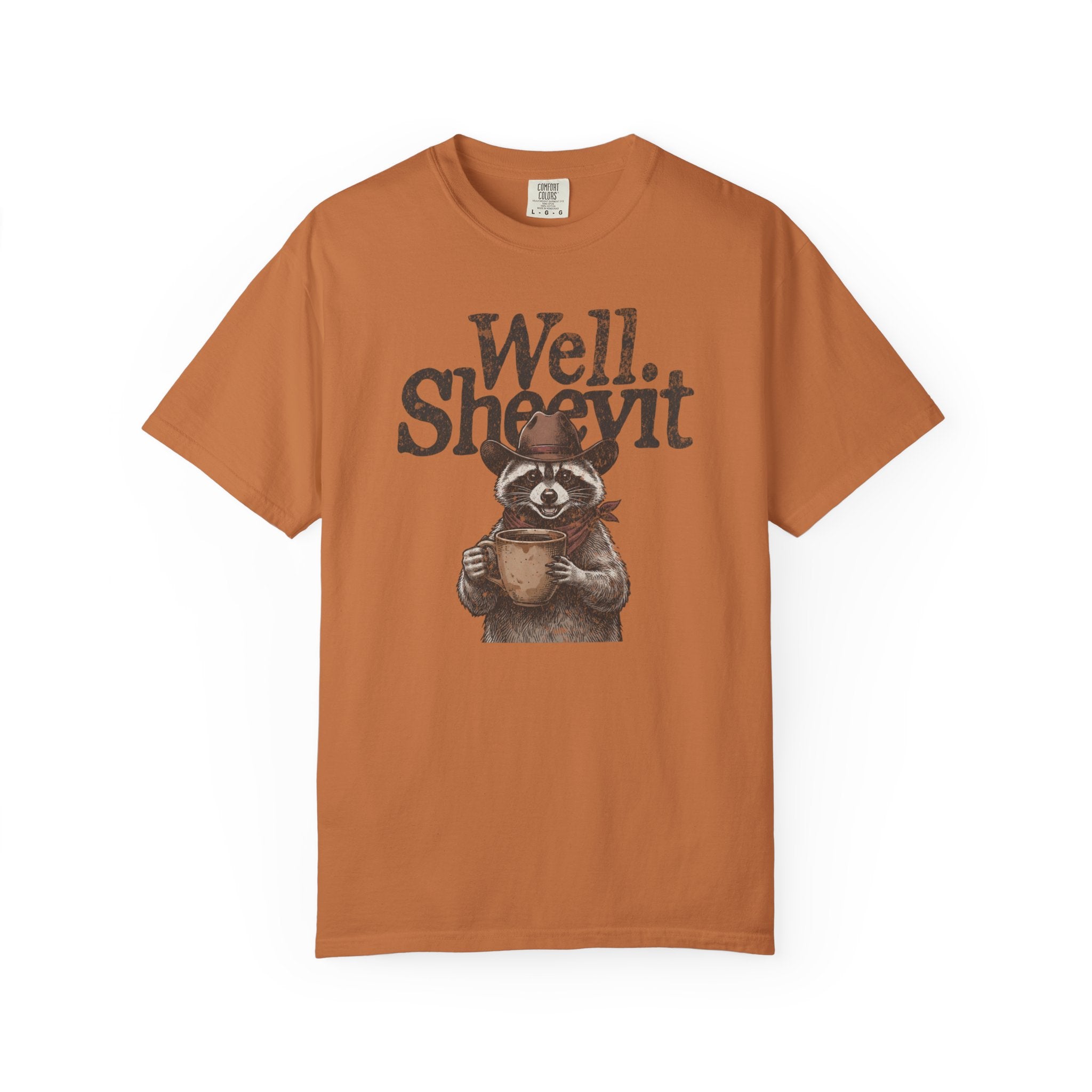 Rust-colored t-shirt with a graphic of a raccoon wearing a cowboy hat and holding a coffee mug.