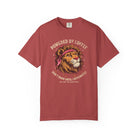 Red t-shirt featuring a graphic of a lion wearing a bandana with the text Powered by Coffee.