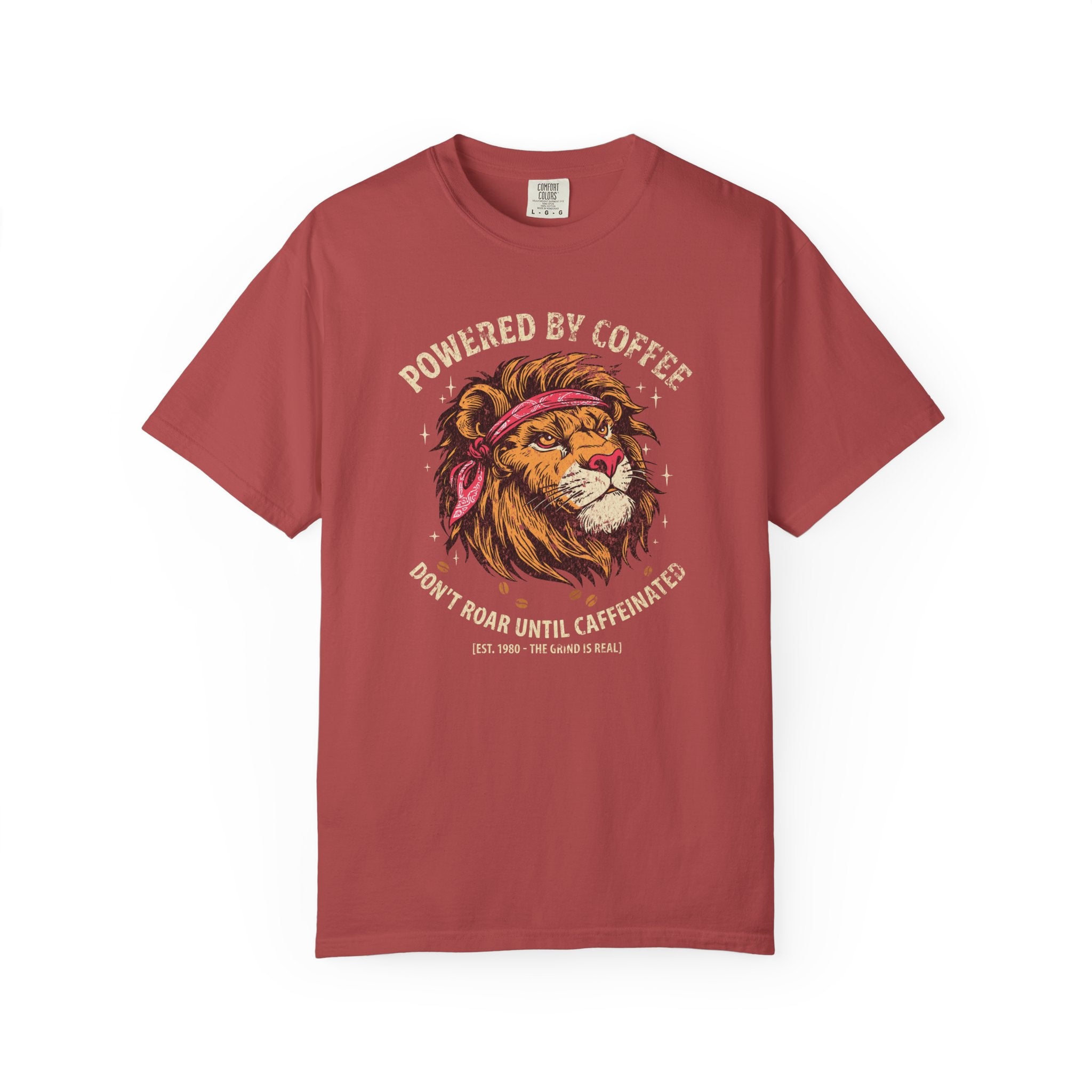 Red t-shirt featuring a graphic of a lion wearing a bandana with the text Powered by Coffee.