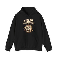 A black hooded sweatshirt featuring a graphic of a panicked coffee mug with the text Help I Need Coffee.