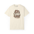 An ivory Comfort Colors t-shirt featuring a distressed retro graphic that says Be Like Coffee.