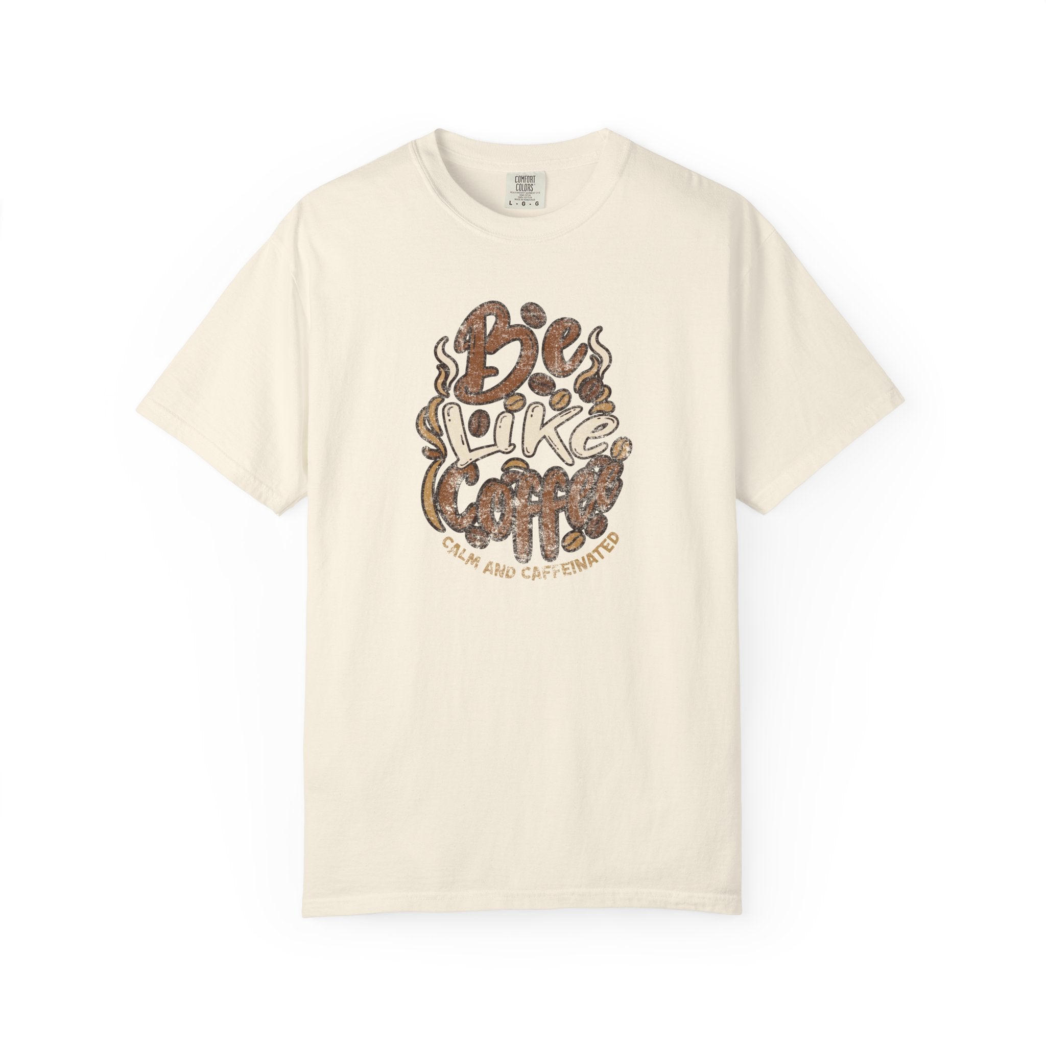An ivory Comfort Colors t-shirt featuring a distressed retro graphic that says Be Like Coffee.