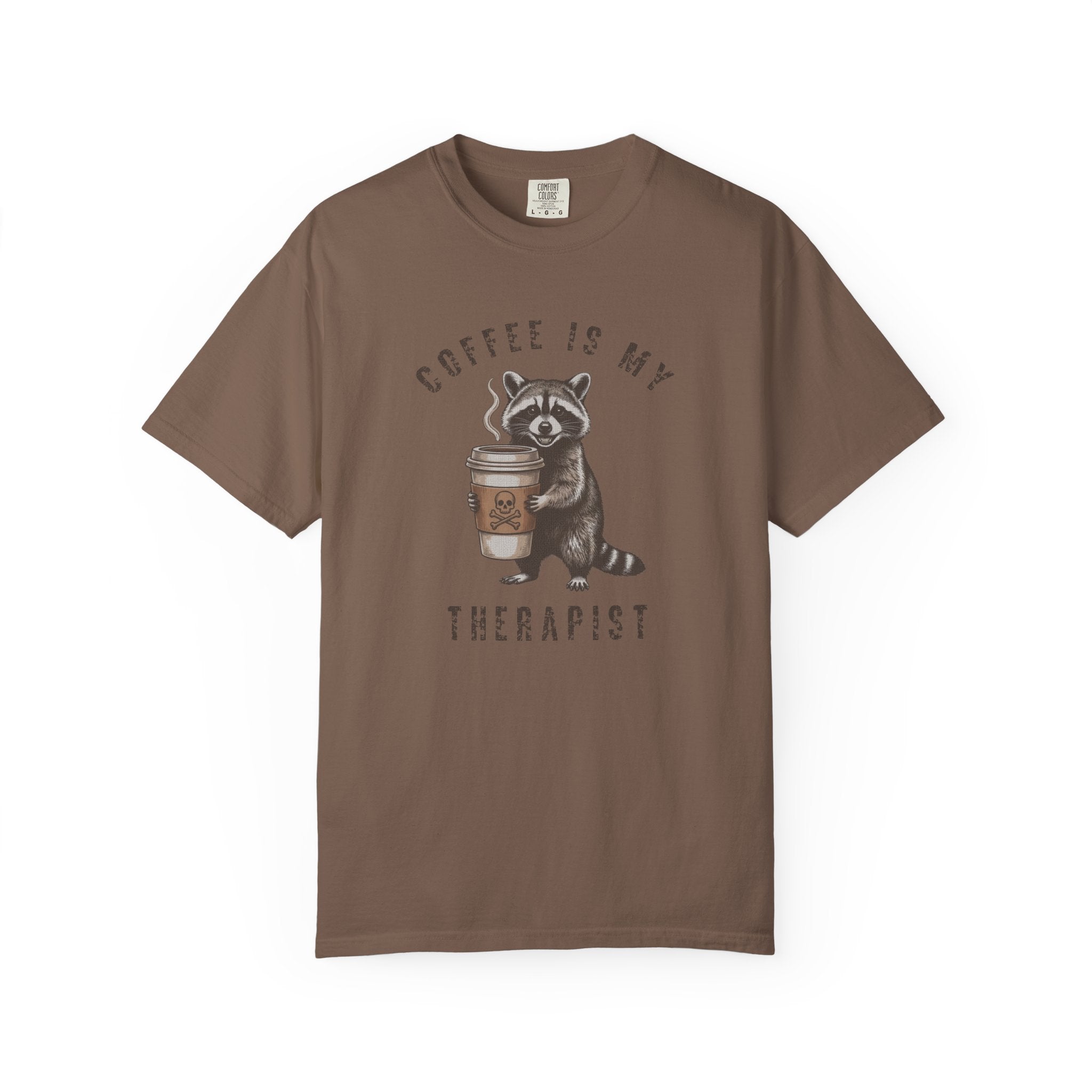 Brown unisex cotton t-shirt featuring a distressed graphic of a raccoon holding a coffee cup.