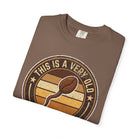 Brown t-shirt with a vintage-style graphic of a coffee bean shaped like a sperm cell.