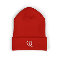 A red cuffed knit beanie featuring a small white embroidered coffee bean graphic.