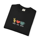 A black heavyweight cotton t-shirt featuring a retro Peace Love Coffee graphic on the front.